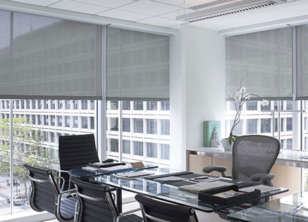Well-lit office with windows and blinds