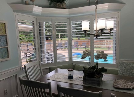 Installed on a dining room window, plantation shutters window treatment are a popular product JAG installs in Rocklege and Viera to add privacy.