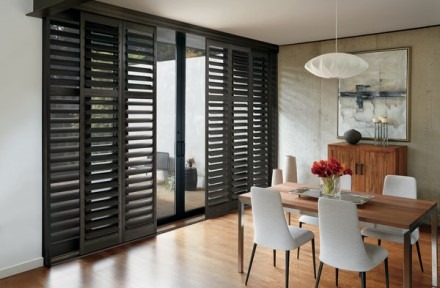 Black plantation shutters in dining room