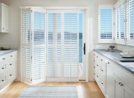 Beach house kitchen with shutters overlooking the beach