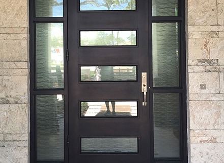 One-way mirror film and a textured decorative film installed on a front door block the view of inside a home.