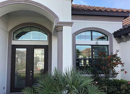 A home in Brevard County has mirror window film on the outside on both the front door and windows.