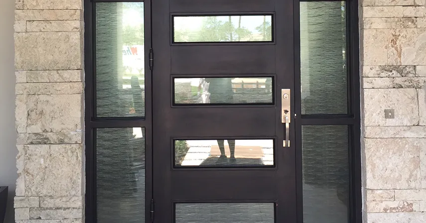 Frosted decorative film, one window treatment idea, blocks the view from a front door of a residential home.