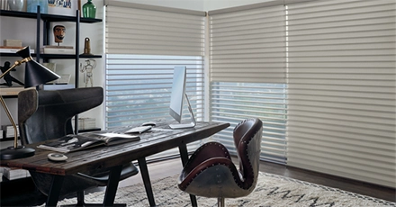 An office with shades to block the sun’s harsh effects